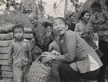 (VIETNAM WAR) CHARLES EGGESTON; NIK WHEELER Group of more than 45 dramatic press photographs by two prominent photojournalists related